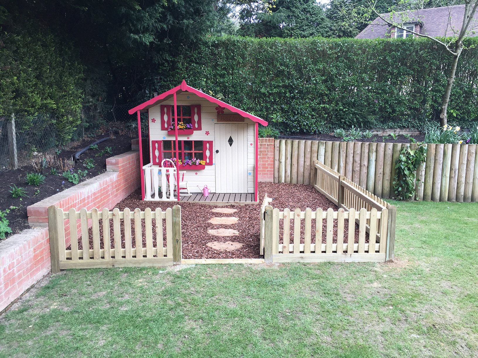 Bark play surface laid within fenced area